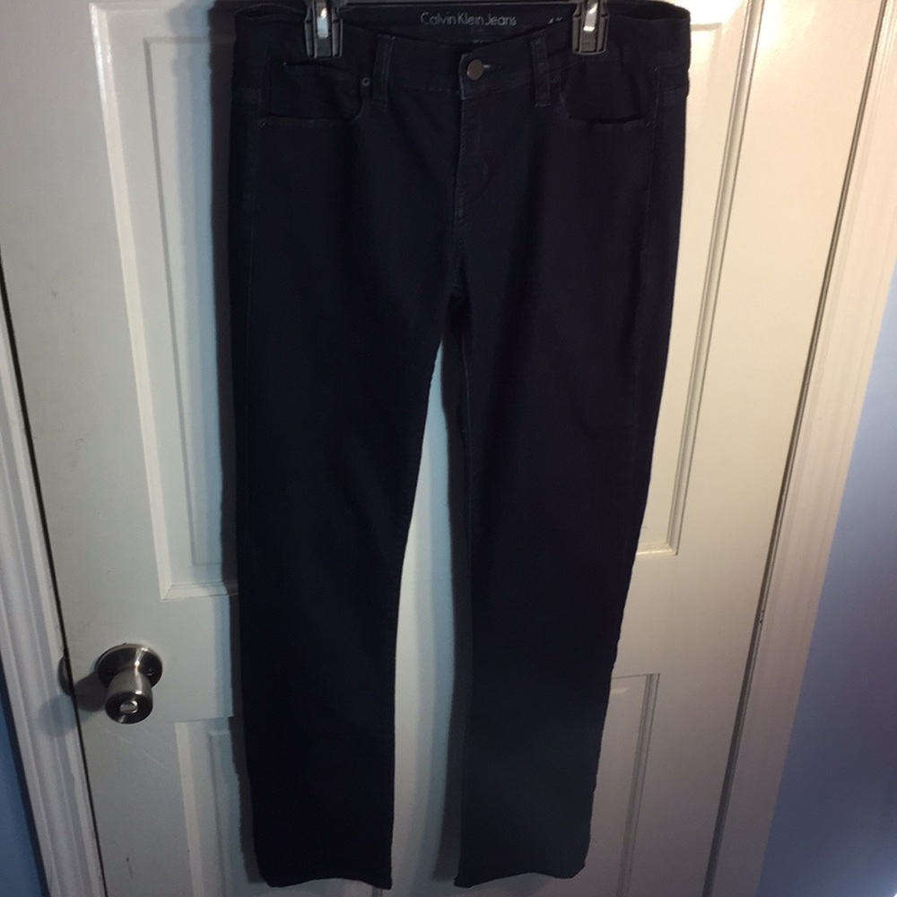 Dark Calvin Klein jeans.